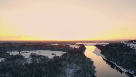 The-Aerial-view-of-snow-covered-winter-forest-in-time-sundown-on-Christmas-Eve.